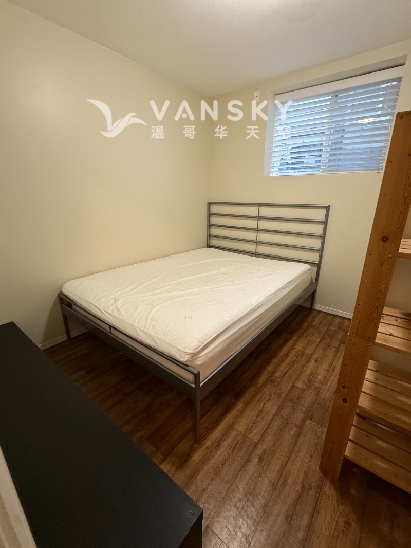 250426162610_2bdrm-1st room with queen size bed.jpg